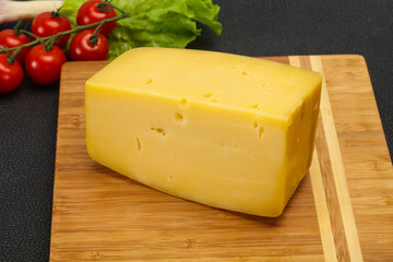 Hard yellow tasty cheese brick