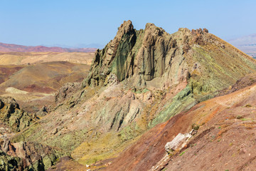 Mountain landscape in the vicinity of Dogubayazit, Eastern Turkey, Agri Province. Multi-colored rocks on the background of blue sky. Typical landscape