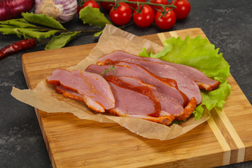 Sliced smoked duck breast served salad