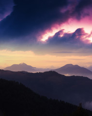 spectacular european summer sunset image, vertical sunrise scenery, foggy hills on background amazing sky, colorful summer evening landscape in the mountains, Carpathians, Europe, Ukraine