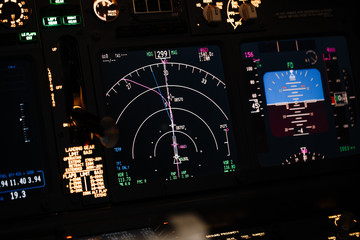 Display navigator system of Boeing aircraft. Automatic landing system. Night shot inside cabin. ILS