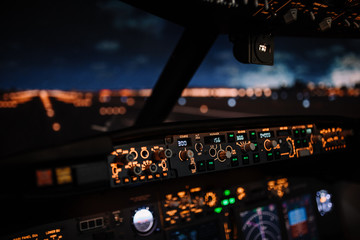 Autopilot controller. Display navigator system of Boeing aircraft. Automatic landing system. Night shot inside cabin. ILS - 338538815