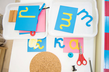 Montessori Education. Montessori School. Learning materials in a Montessori methodology school. Learning letters. Letters to learn to write and read.
