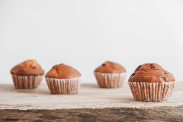 Chocolate cupcakes on wooden table background. Copy, empty space for text