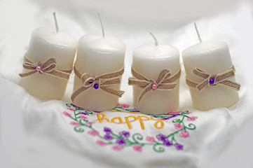 white candles with bows