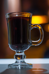 Mulled wine in a glass isolated on a dark background