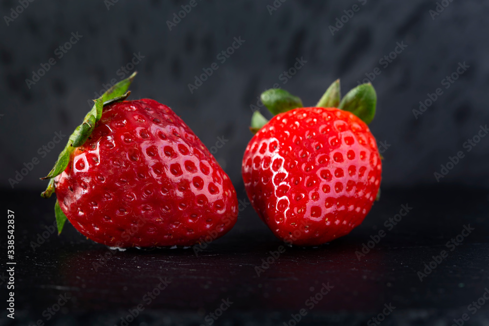 Wall mural fresh strawberry on a dark slate