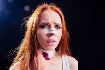 Fototapeta premium redhaired ginger woman in black dark room