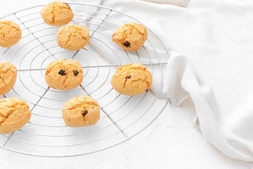 Cooling rack with sweet cookies on table