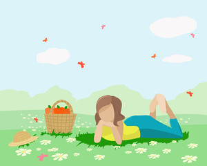 Obraz na płótnie Canvas A girl lies in a meadow in the summer sun