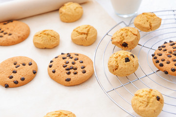 Cooling rack with sweet cookies on table