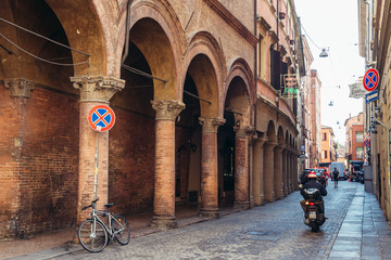 Traditional portico on Volturno Street in historic part of Bologna city, Italy © Fotokon