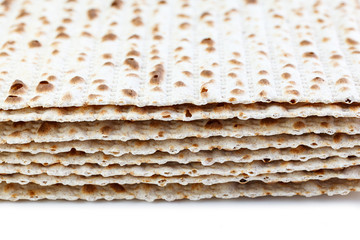 Matzah. Jewish traditional Passover bread. Pesach celebration symbol. Isolated on white. With some free space for your text or sign . Close-up.