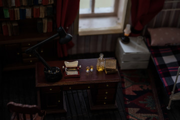 A realistic dollhouse living room with furniture and window at night. Artwork table decoration with handmade realistic dollhouse.