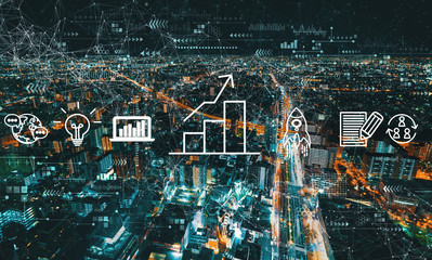 Business growth analysis with aerial cityscape view of Japan at night