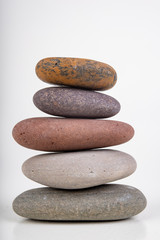 Fototapeta na wymiar Round stones stacked. Stones found on the sea beach.