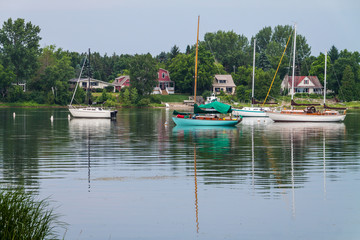 Fototapeta na wymiar Small Sailboats Anchored in the Sturgeon Bay Ship Canal, Sturgeon Bay, Wisconsin, USA