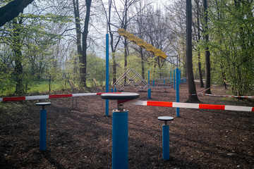 Fototapeta na wymiar Outdoor workout trainings grounds blocked with barrier tape during Corona pandemic lockdown on Easter Monday 2020 in Regensburg, Bavaria, Germany