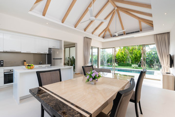 Interior design of open space dining room and kitchen in pool villa, house, home, condo and apartment feature kitchenette