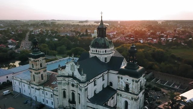Aerial view of Monastery of the Barefoot Carmelites at sunset, Medieval Catholic ancient fortress in Berdichiv city, Ukraine. Monastery of the Barefoot Carmelites, Aerial survey of Monastery of the Ba