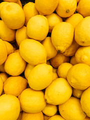 lots of ripe yellow lemons for eating background