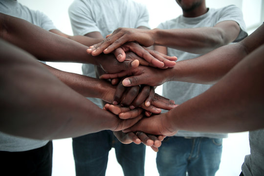 close up. a multi-ethnic group of friends showing their unity