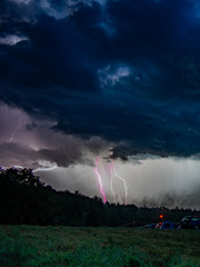 storm clouds and lightning over a camping ground