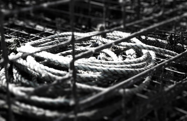 Black and White crab fishing cages with ropes