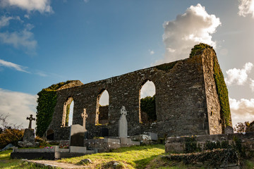 Fototapeta na wymiar Cemetery and ruins of a Gothic Protestant church built in 1778 on top of a hill in Ennistimon, County Clare, Ireland.