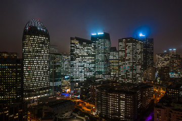 Fototapeta na wymiar Aerial drone night shot of Skyscrapers with lights on in La Defense, financial district of Paris