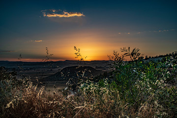 Fototapeta premium romantic scenery of the sunset over the mountains and beautiful landscape on cyprus and colorful purple and orange sky