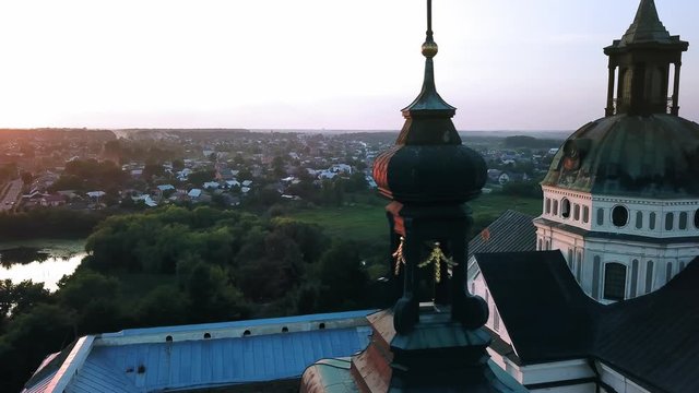 Aerial view of Monastery of the Barefoot Carmelites at sunset, Medieval Catholic ancient fortress in Berdichiv city, Ukraine. Monastery of the Barefoot Carmelites, Aerial survey of Monastery of the Ba