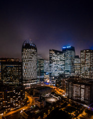 Aerial drone night shot of Skyscrapers in the night with lights on in La Defense, financial CBD district of Paris