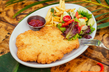 potato pancakes and salad on tropics resort exotic spa