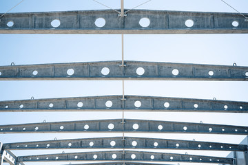 Industrial construction on site of new warehouse factory buildings.
Concrete beams, girders