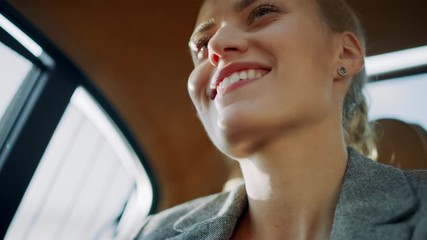 Closeup sexy business woman relaxing at car. Beautiful girl dancing at backseat