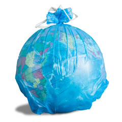 Globe in a plastic garbage bag close-up isolated on a white background. Concept: nature protection, environmental problems in the world.