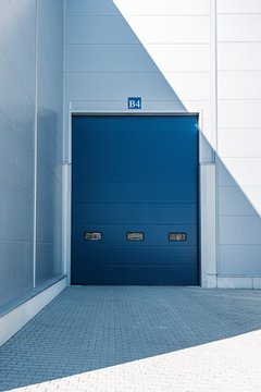 Blue entrance gate to the warehouse