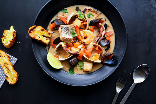 seafood stew with clams, mussels, and salmon
