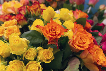 Caramel color, yellow and red roses. Beautiful fresh bouquet