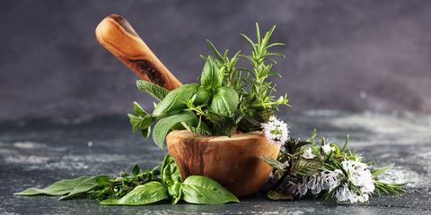 Homegrown and aromatic herbs on rustic background with rosemary and basil - obrazy, fototapety, plakaty