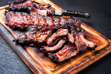 Barbecue pork spare loin ribs St Louis cut with hot honey chili marinade sliced and burnt as...