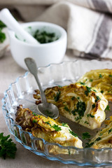 Baked young cabbage served with chimichurri sauce and parsley.