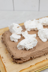 White whipped cream on the chocolate cake