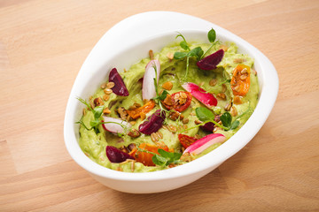 Organic plant based hummus with granola tomato, fresh thymes and rose leaf toppings. Perfect for vegan gluten free.