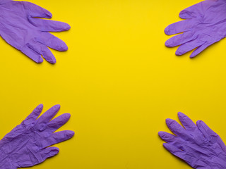 Thanks to health care professionals for their fight against the pandemic coronavirus. Medical gloves isolated on yellowv background Personal protective equipment. Disease Covid-19. disposable gloves. 