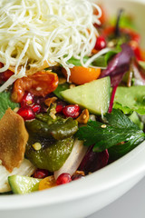 Homemade fattoush salad with vegan cheese toppings. Organic food perfect for delivery. Food photography focus view. Arabic dish for vegetarian.