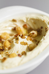 Organic plant based hummus with granola and chick peas toppings. Perfect for vegan gluten free. Freshly homemade for takeaway and delivery. Focus view.