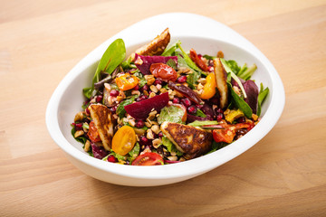 Tasty homemade vegan salad with granola grilled cheese and beet root. Organic food photography. For healthy living lifestyle. Food photography.