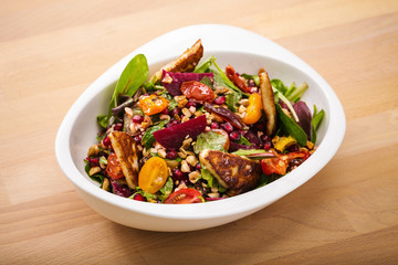 Tasty homemade vegan salad with granola grilled cheese and beet root. Organic food photography. For healthy living lifestyle. Food photography.